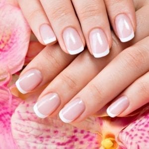 Beautiful woman's nails with beautiful french manicure