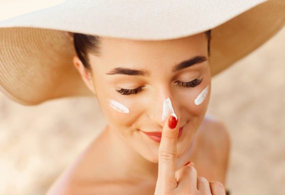 woman, wearing, sunscreen, on, face