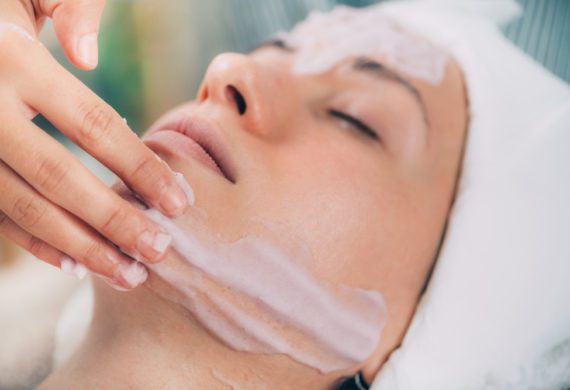 woman, getting, facial, with, towel, on, her, head